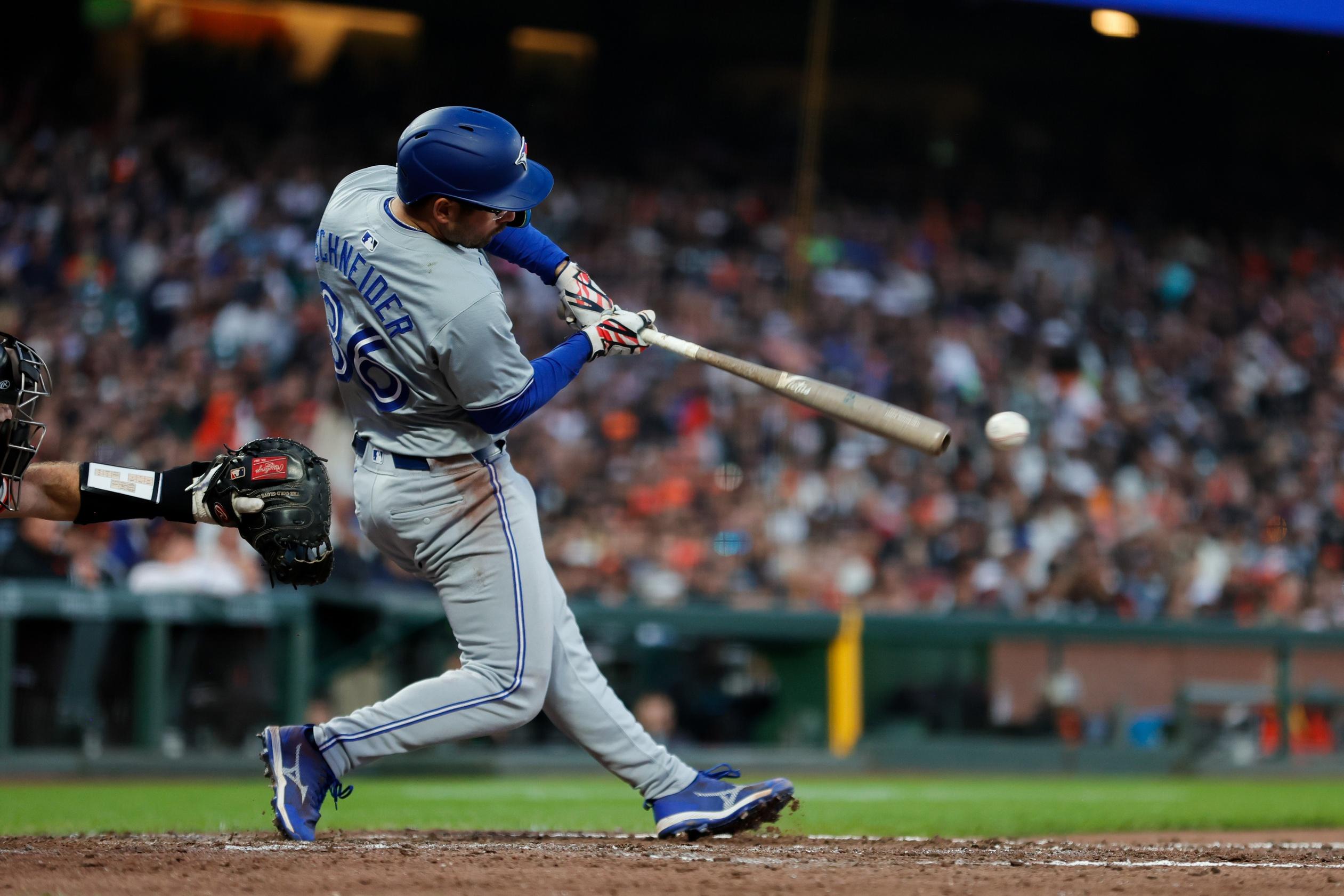 Toronto Blue Jays outfielder Davis Schneider (36) hits a RBI single during the sixth inning against the San Francisco Giants at Oracle Park.